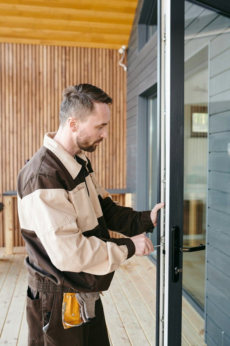 Technician installing a glass glass door